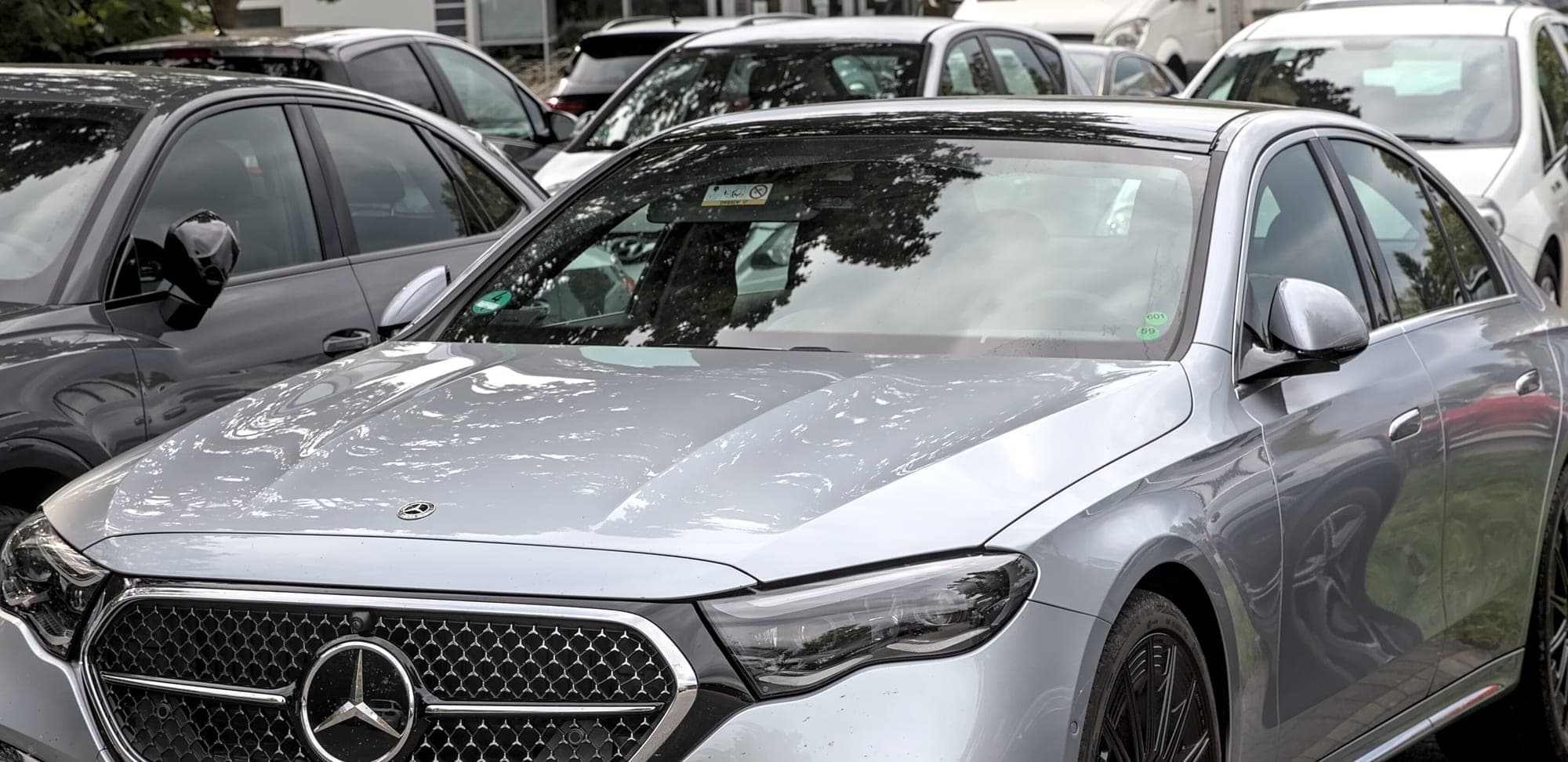 A silver Mercedes-Benz E-Class saloon, the type of car used for everyday journeys.